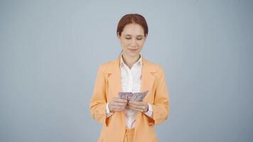 Rich business woman counting money. video