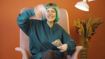 Young woman distributing banknotes and tossing them into the air. video