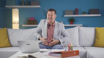 Home office worker man has stomachache. video