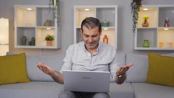 Man closing laptop with angry expression. video