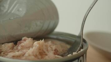 canned tuna on wooden table , video