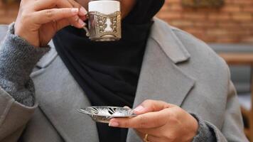 woman drinking turkish coffee at cafe video