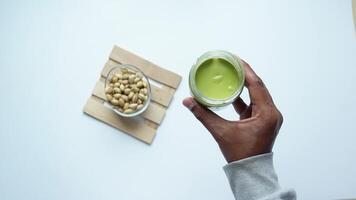 top view a pistachios cream and nuts in a bowl video