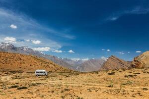 Car in Himalayan landscape photo