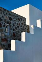 Greek architecture abstract background - whitewashed house with stairs. Milos island, Greece photo