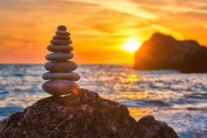 Concept of balance and harmony - stone stack on the beach photo