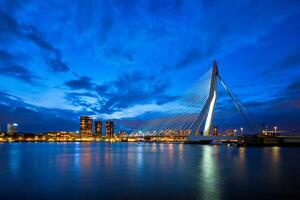 View of Erasmus Bridge Erasmusbrug and Rotterdam skyline. Rotterdam, Netherlands photo