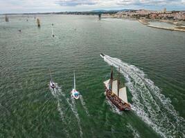 Tall ships sailing in Tagus river. Lisbon, Portugal photo