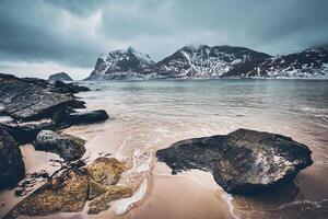 Rocky coast of fjord in Norway photo