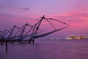 Chinese fishnets on sunset. Kochi, Kerala, India photo