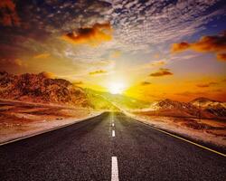 Road in Himalayas with mountains photo