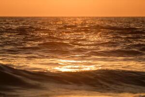 Ocean on sunset background photo