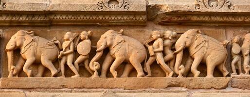 Stone carving bas relief panorama, Lakshmana Temple, Khajuraho, photo