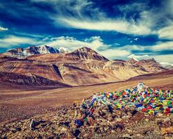 Buddhist prayer flags lungta at mountain pass in Himalayas photo