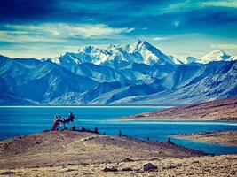 Buddhist prayer flags lungta at Himalayan lake Tso Moriri photo