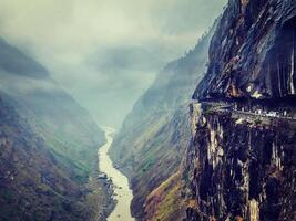 Car on road in Himalayas photo