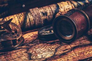 Old vintage compass on ancient map photo