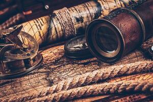 Old vintage compass on ancient map photo