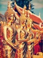 Gold Buddha statues in Wat Phra That Doi Suthep photo