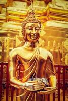 Gold Buddha statue in Wat Phra That Doi Suthep photo