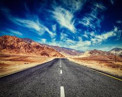 Road in Himalayas with mountains photo