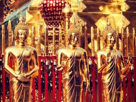 Gold Buddha statues in Wat Phra That Doi Suthep photo