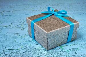 Gift box with blue ribbon photo