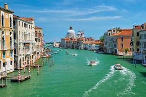View of Venice Grand Canal and Santa Maria della Salute church on sunset photo