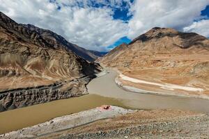 Confluence of Indus and Zanskar Rivers in Himalayas photo