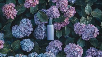 A cream bottle on a flower bed full of darker and light purple flowers. photo