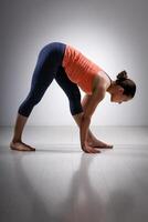 Woman stretching in Ashtanga Vinyasa yoga asana photo