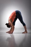 Woman stretching in Ashtanga Vinyasa yoga asana photo