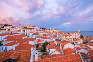 View of Lisbon from Miradouro de Santa Luzia viewpoint on sunsets. Lisbon, Portugal photo