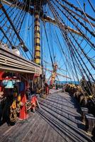 Deck with masts and ropes of wooden Age of sail sailing ship photo