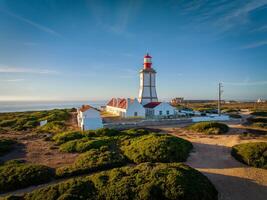 Lighthouse on Cabo Espichel cape Espichel on Atlantic ocean photo