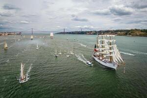 Tall ships sailing in Tagus river. Lisbon, Portugal photo