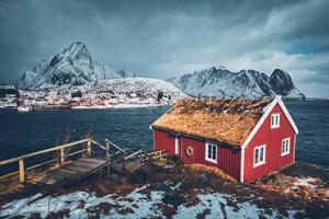 Traditional red rorbu house in Reine village on Lofoten Islands, photo