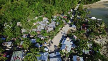 Poor fishing village in Asia on the seashore, drone view video