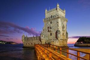 Belem Tower on bank of Tagus River in twilight. Lisbon, Portugal photo