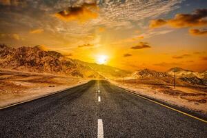 Road in Himalayas with mountains photo