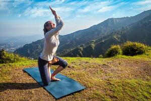 Woman doing Ashtanga Vinyasa yoga advanced asana photo