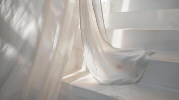 White linen fabric draped over a white staircase. photo