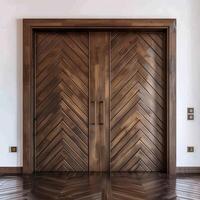 Dark brown wooden door with diagonal grooves on the surface with white wall in background. photo