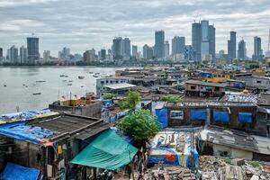 View of Mumbai skyline over slums in Bandra suburb photo