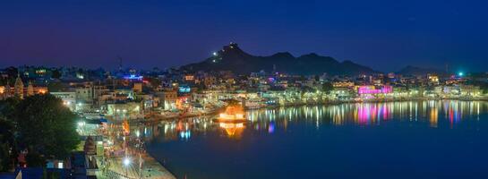 View of famous indian sacred holy city Pushkar with Pushkar ghats. Rajasthan, India. Horizontal pan photo