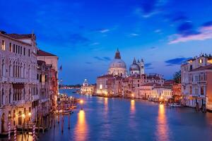 View of Venice Grand Canal and Santa Maria della Salute church in the evening photo