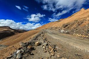 Dirt road in Himalayas photo