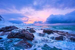 Norwegian Sea waves on rocky coast of Lofoten islands, Norway photo