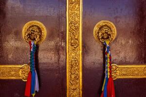 Door handles in Buddhist monastery photo