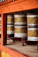 Buddhist prayer wheels in Hemis monstery. Ladakh, India photo